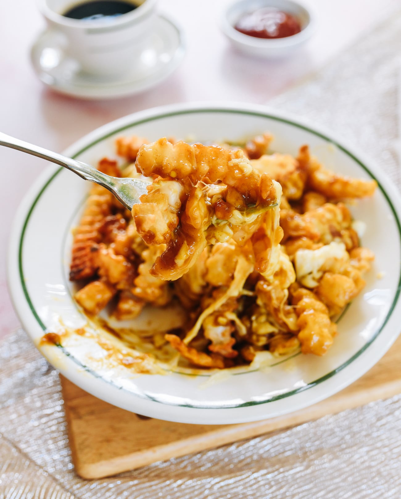Forkful of disco fries with gravy and mozzarella
