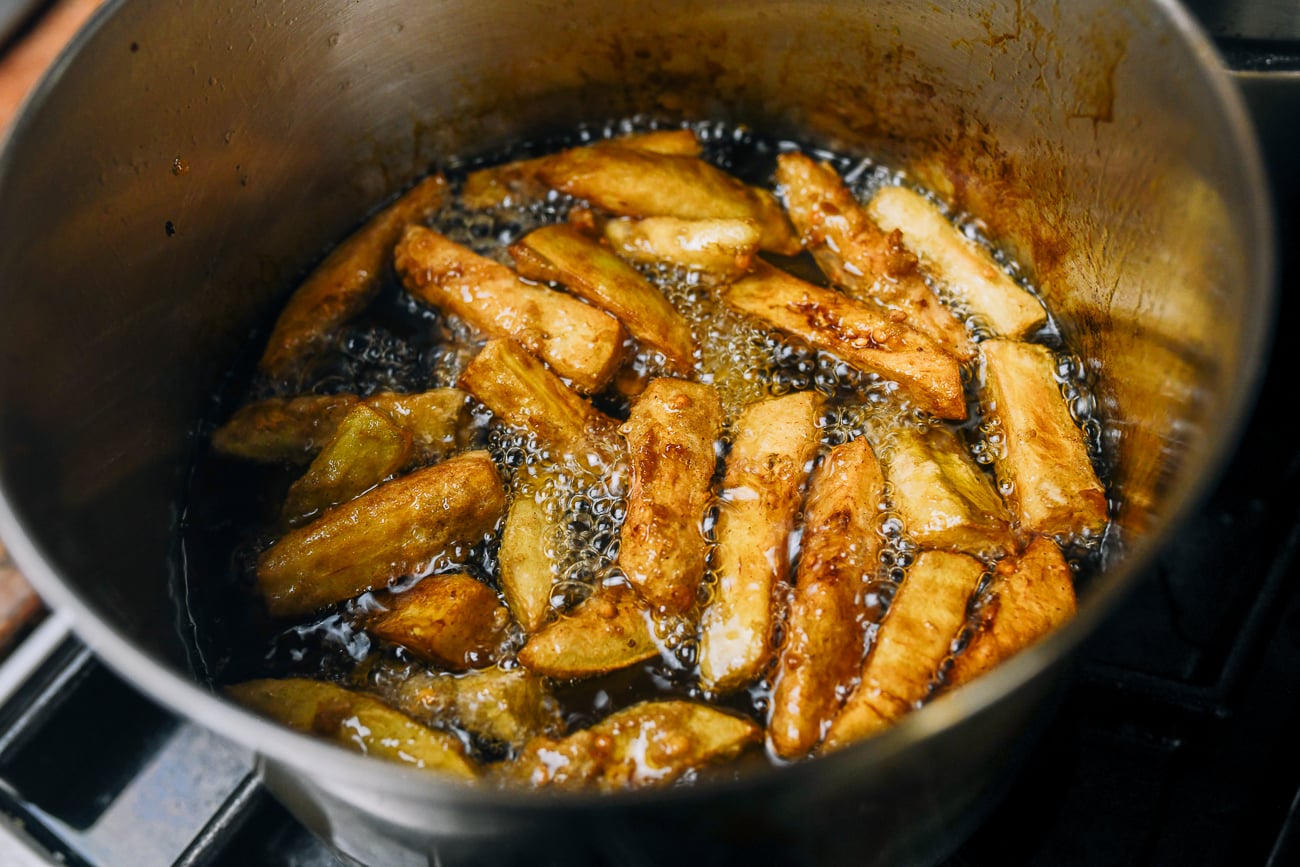 fried eggplant in pot of oil