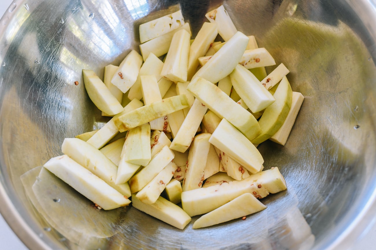 eggplant sticks in metal mixing bowl