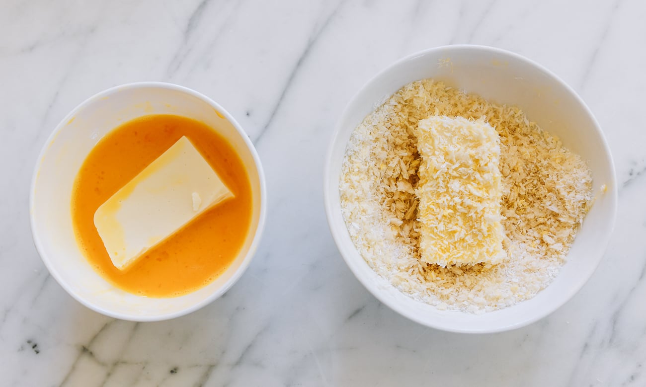 dredging milk pudding in egg and then coconut panko breadcrumb mixture