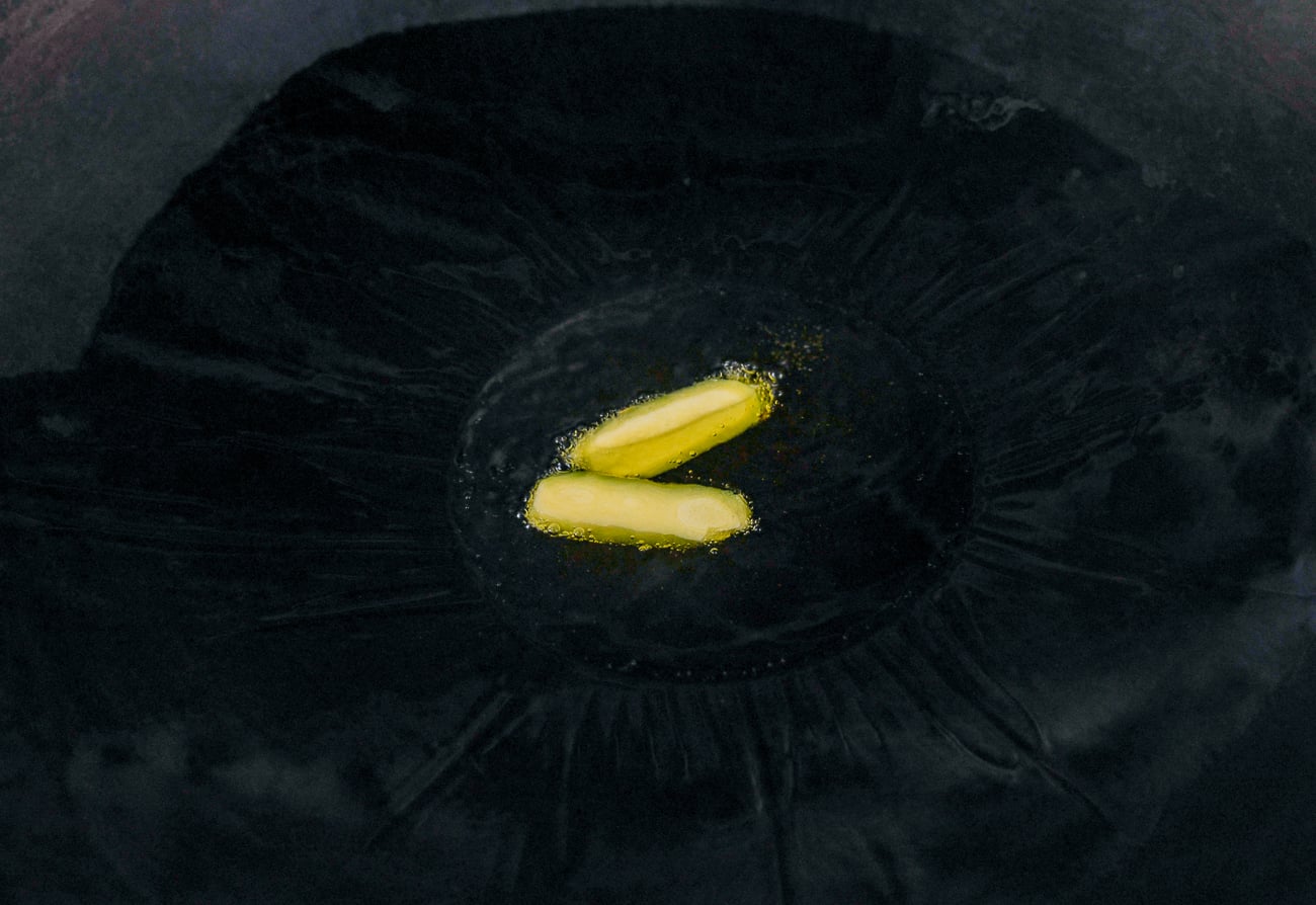 ginger slices in oil in wok