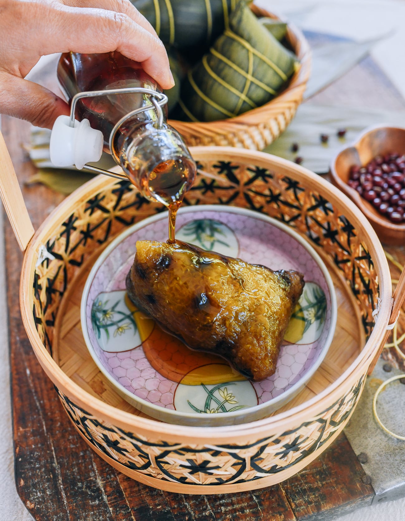 drizzling maple syrup onto Red Bean Zongzi