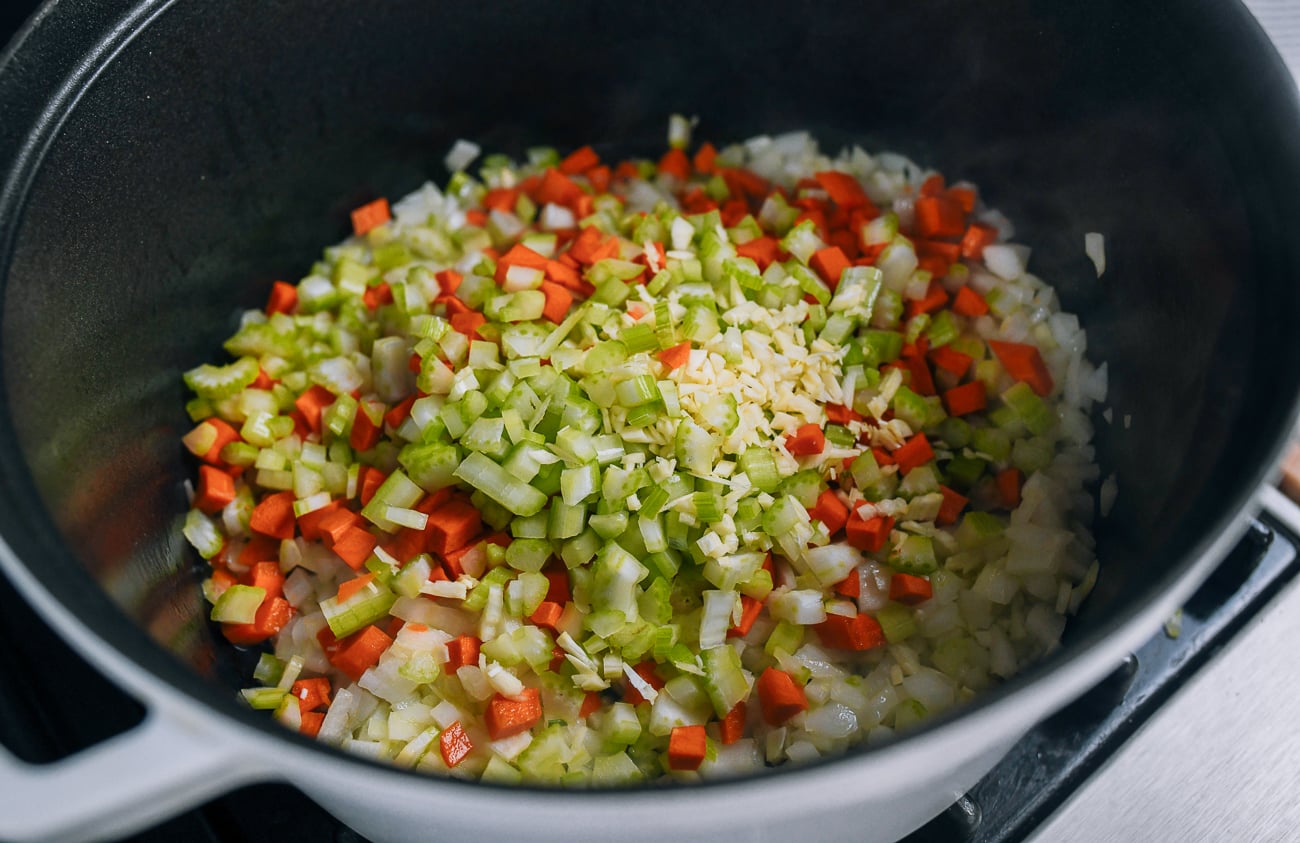 cooking onion, carrot, celery, and garlic in dutch oven
