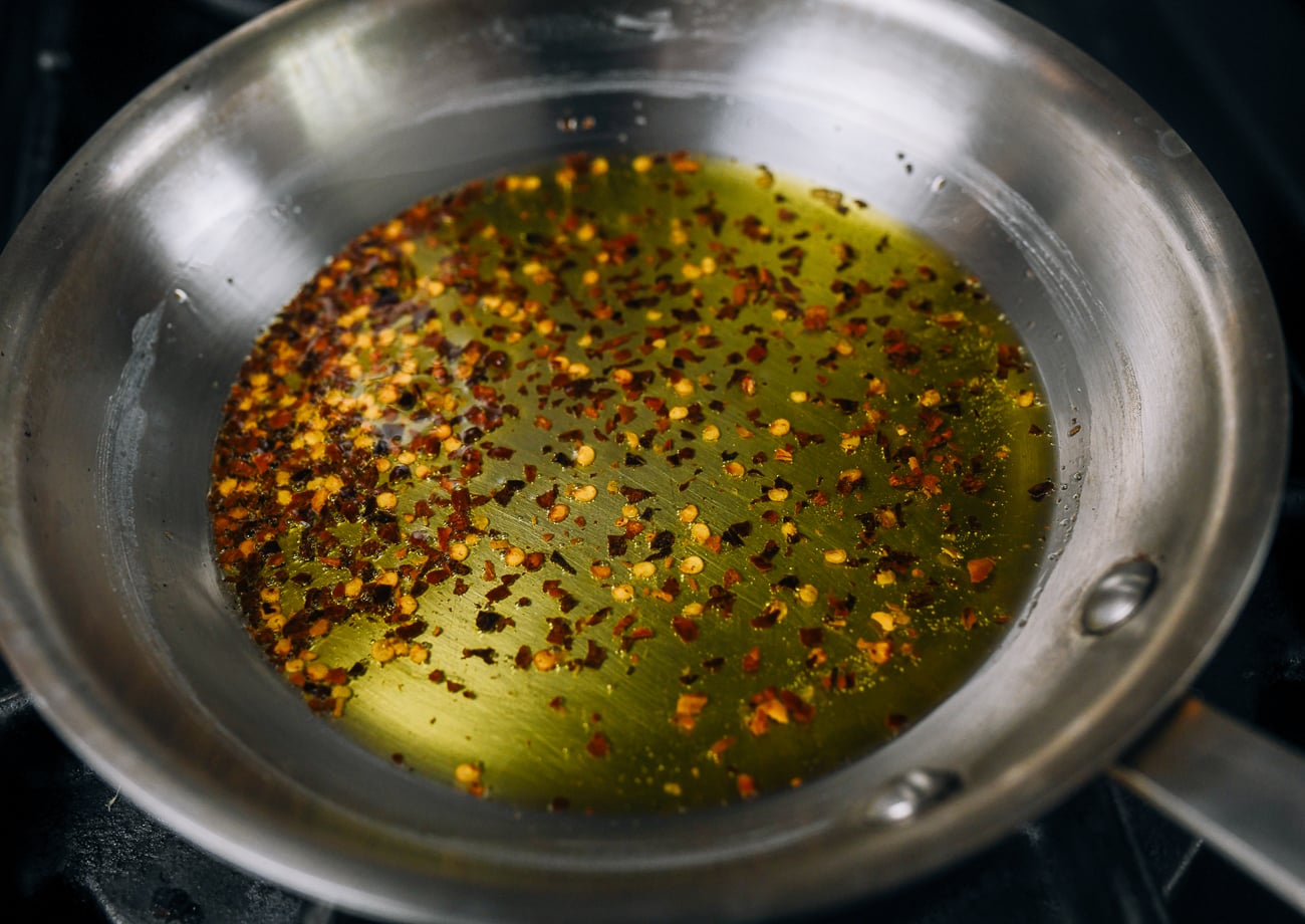 heating crushed red pepper flakes in extra virgin olive oil