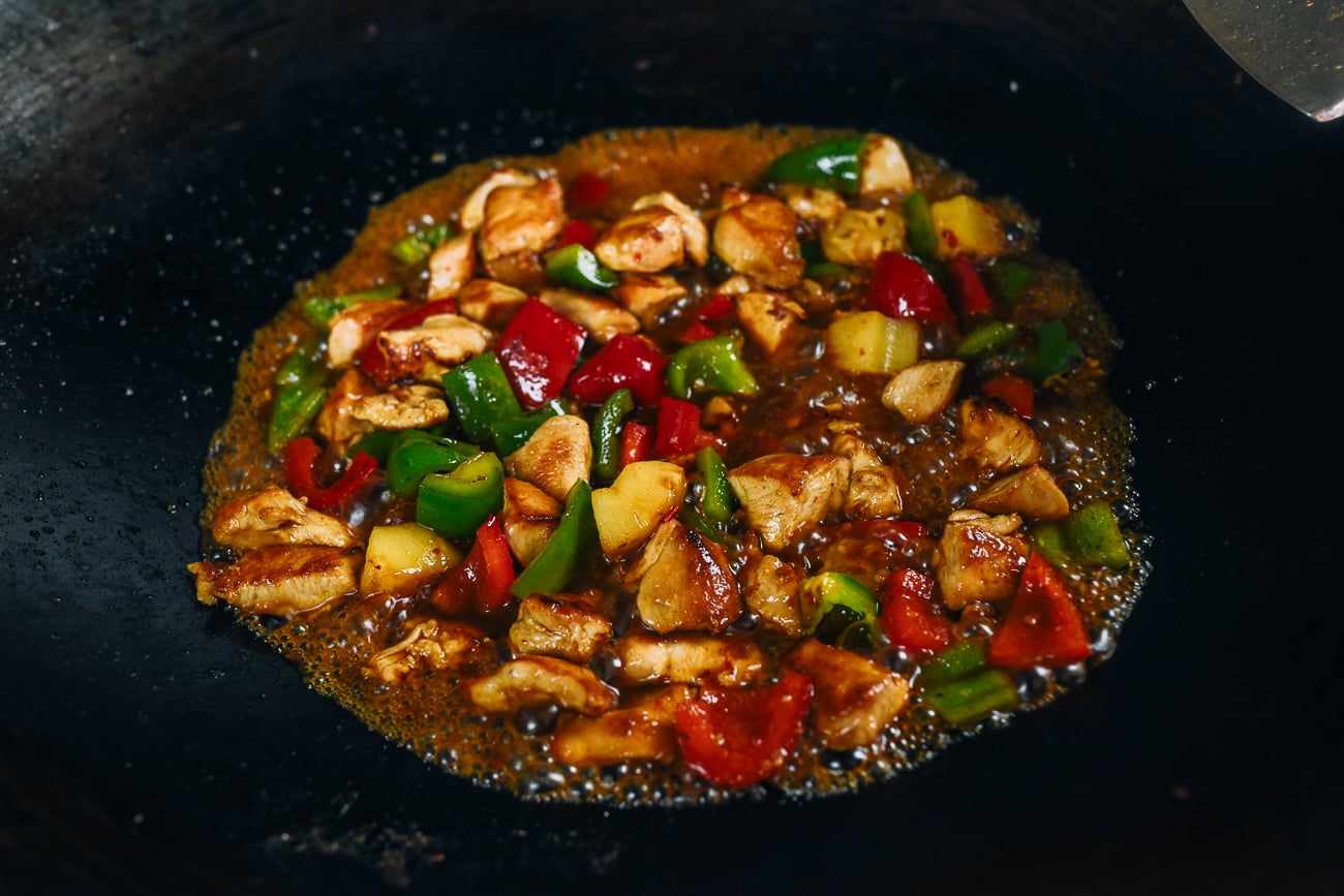 stir-frying pineapple chicken