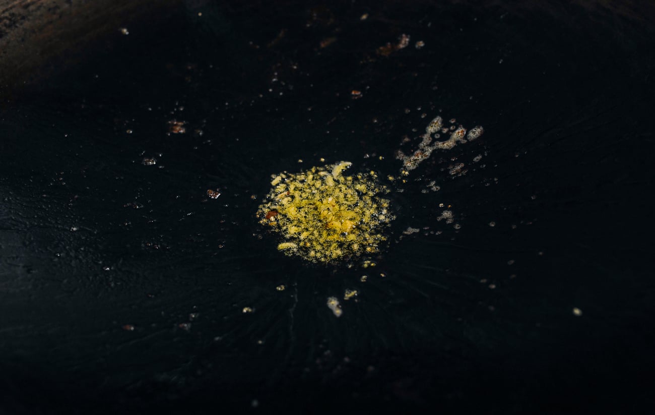 minced ginger in wok