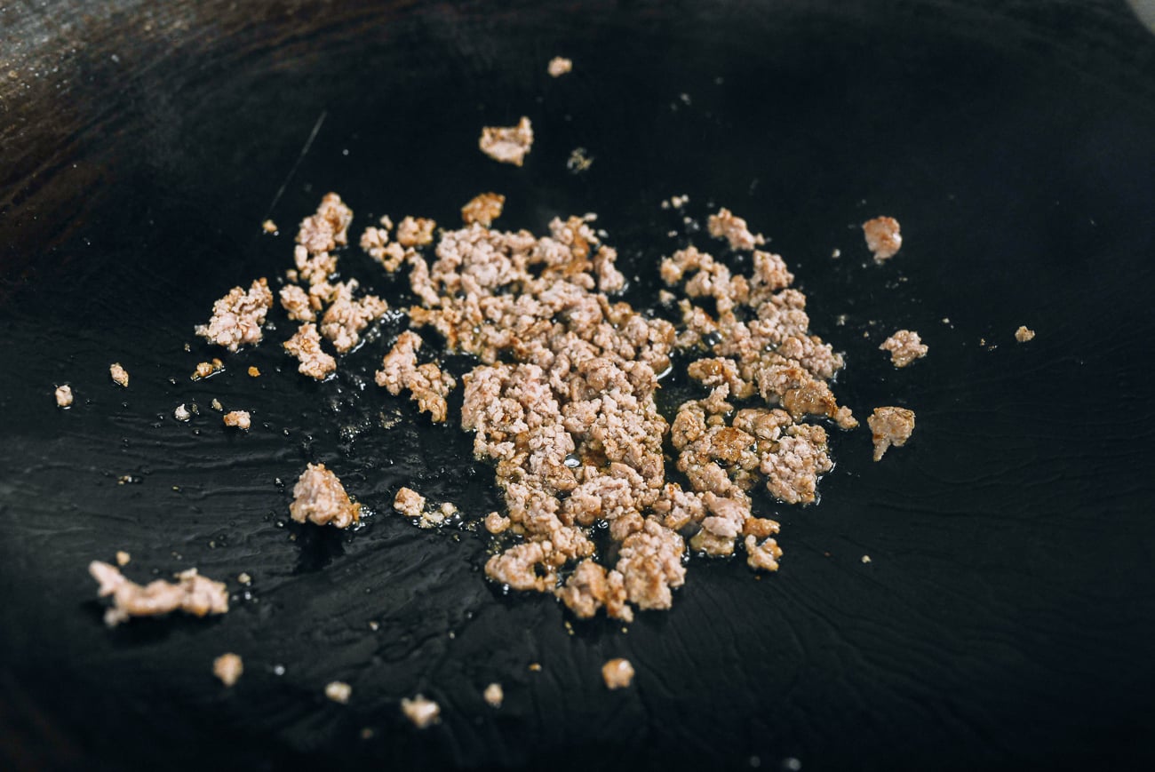 browned ground pork in wok