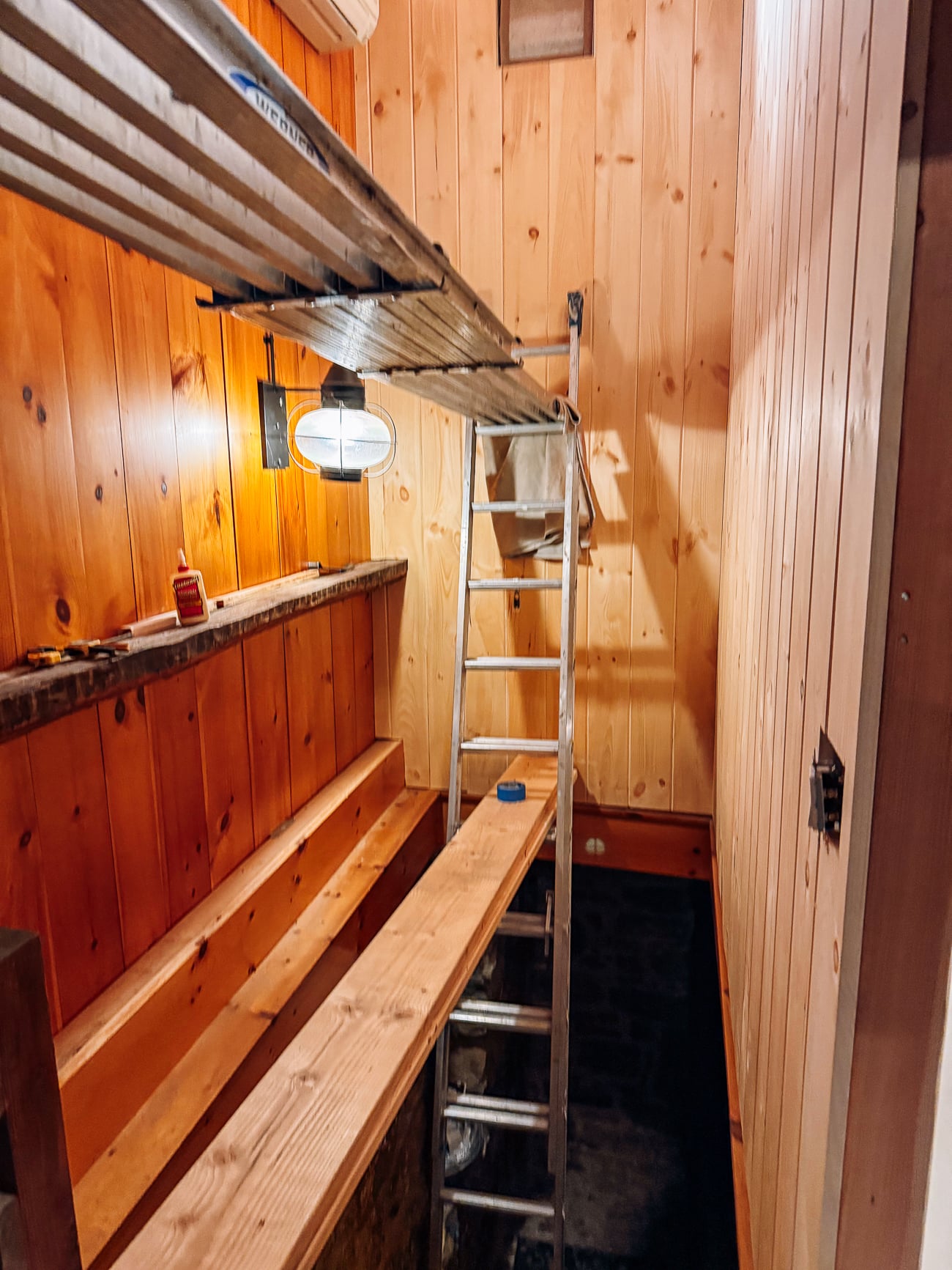 putting siding up in stairwell