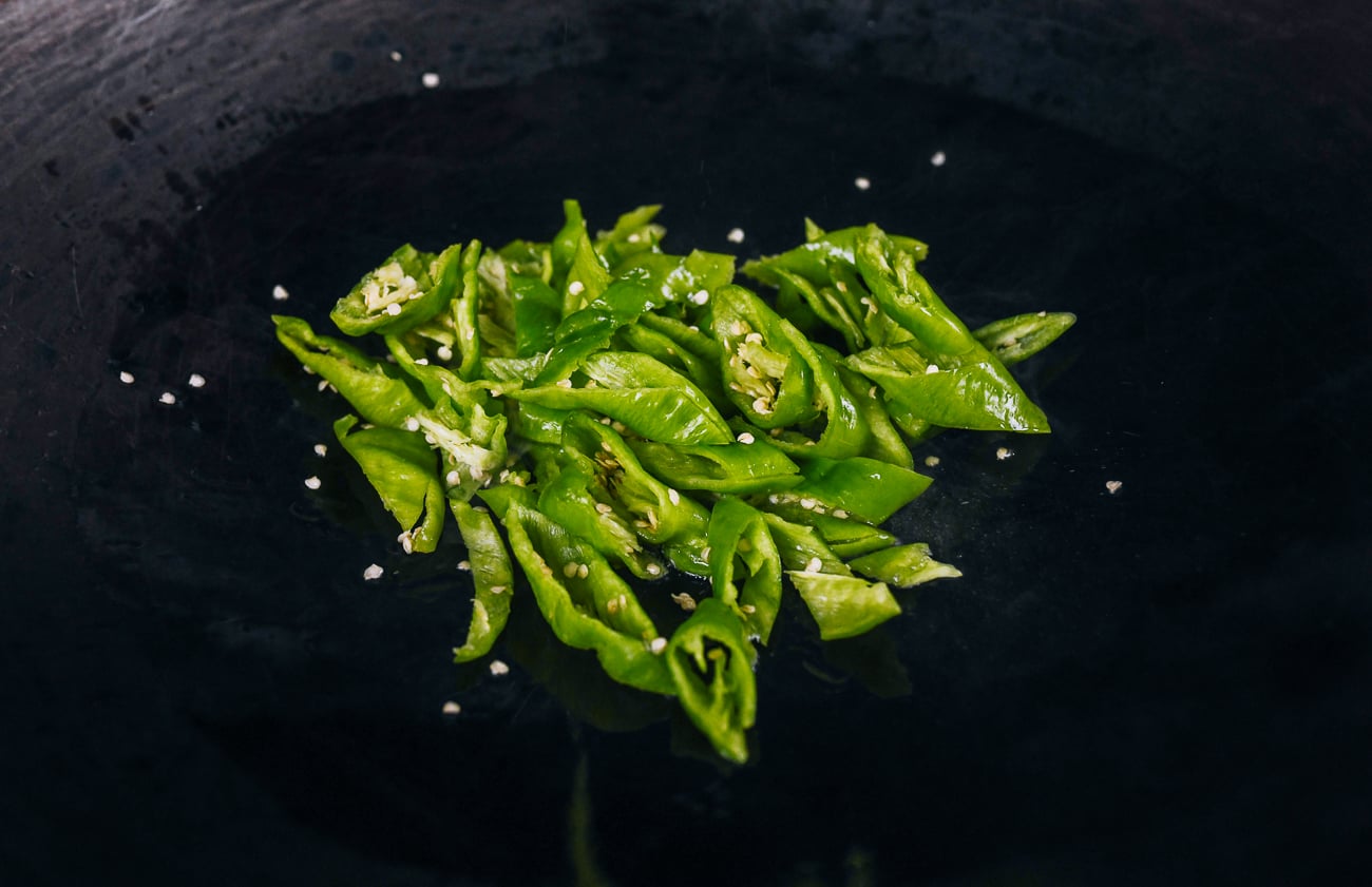 long hot green peppers in wok