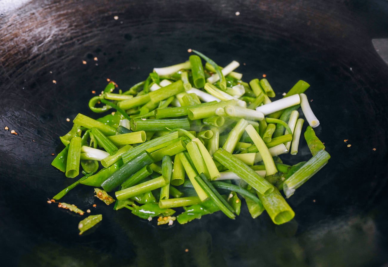 scallions and peppers in wok