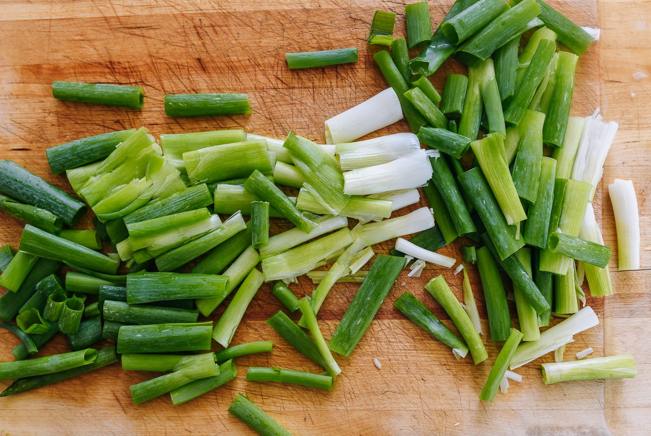 smashed scallions on cutting board